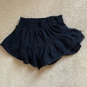 Black aerie shorts with ruffled detailing and rushed waistband